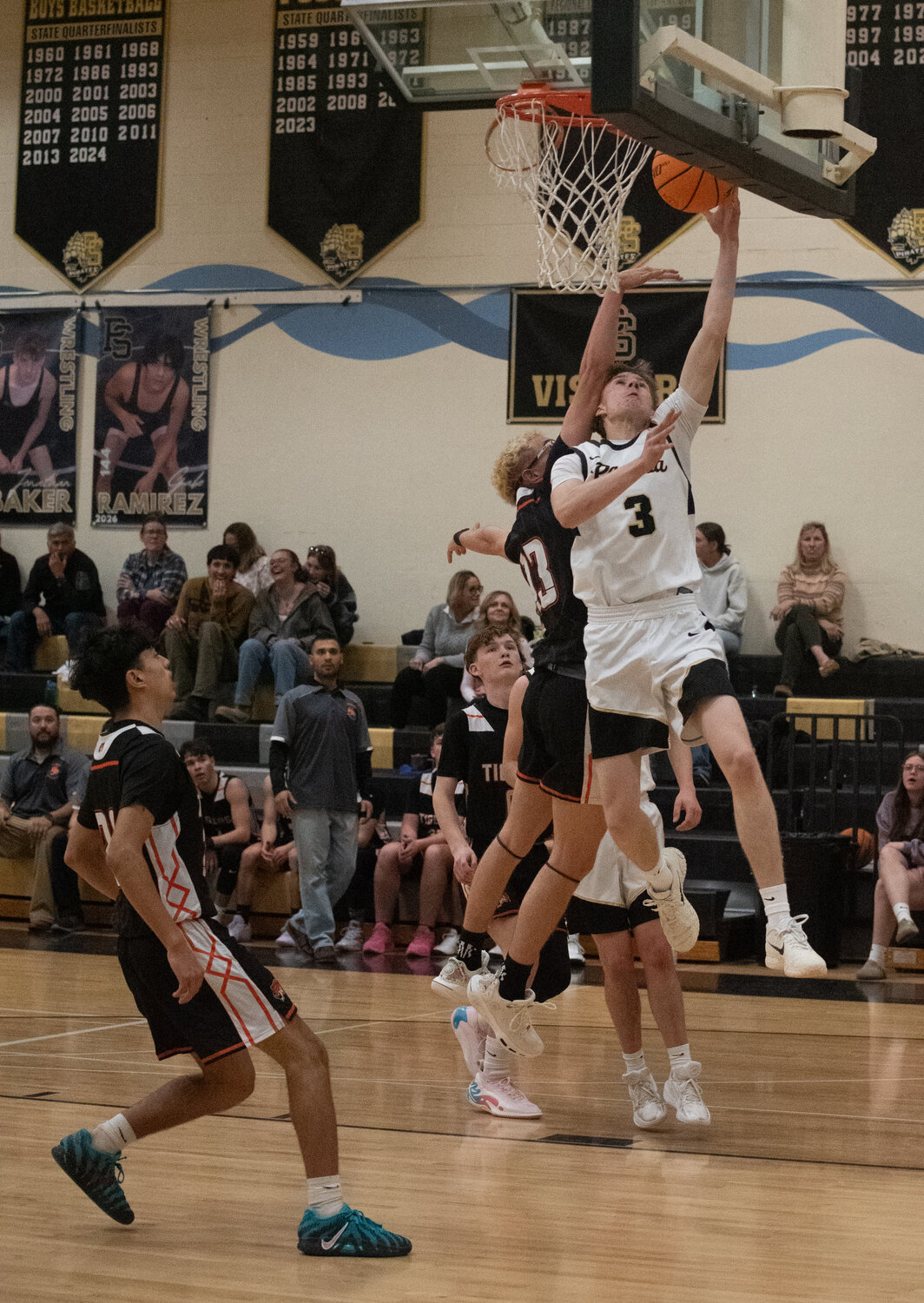 Pirate Duke Ketchum puts up a shot against the Del Norte Tigers on Tuesday, Feb. 3. Ketchum had 26 points over three games last week, with the Pirates winning all three.
