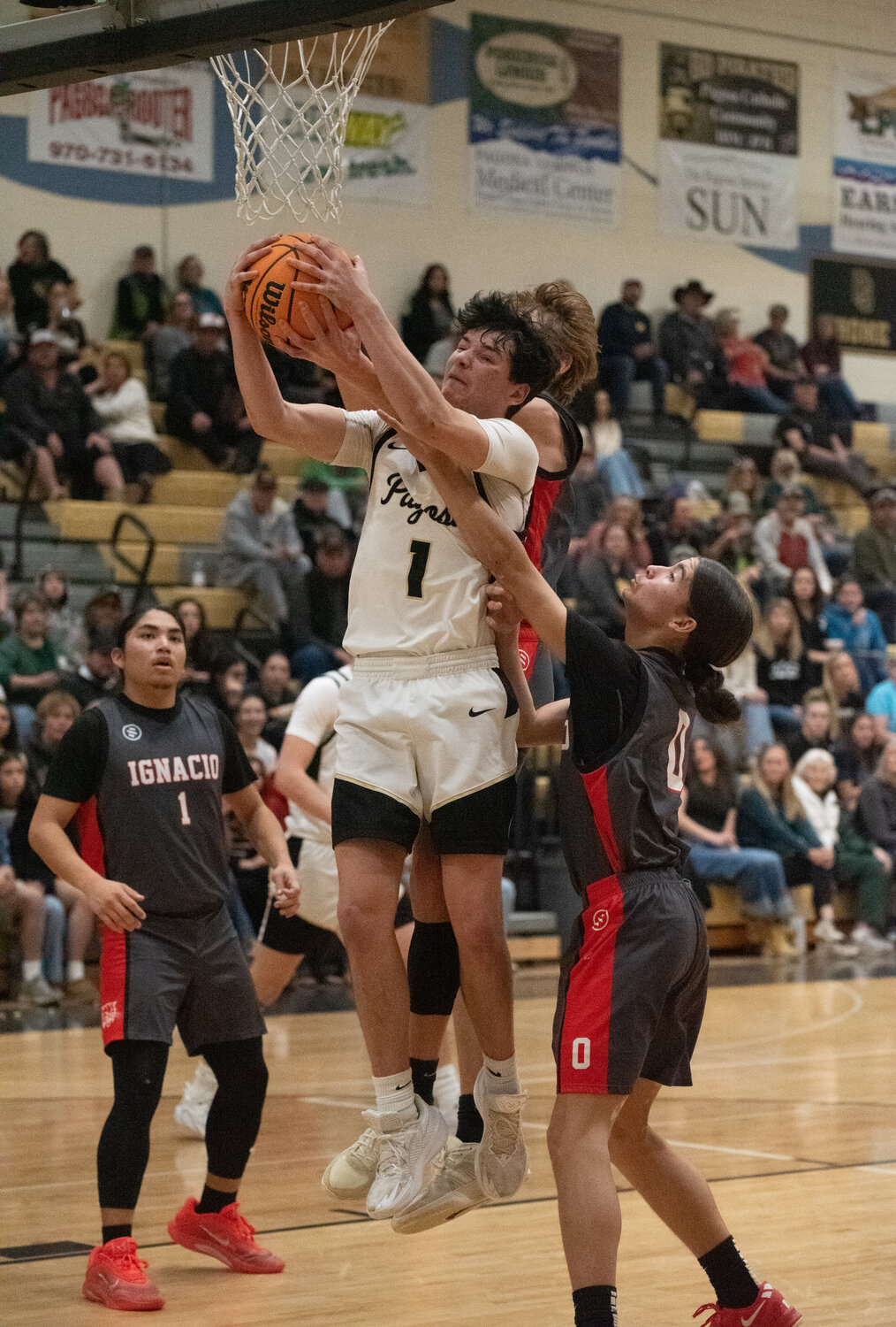 Pirate Creede Dozier fights for a rebound with an Ignacio defender during the Pirates&rsquo; 46-35 win on Saturday, Feb. 7. Dozier had two rebounds and 13 points on the day.
