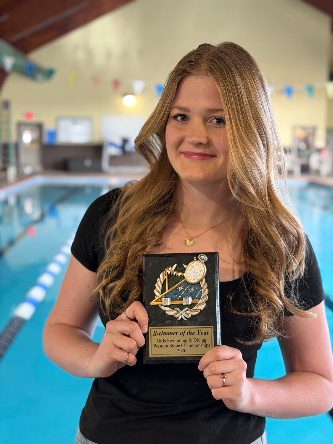 Lady Pirate Asia Gorman poses with her plaque for being named the Southwest Conference Swimmer of the Year last weekend in Grant Junction.