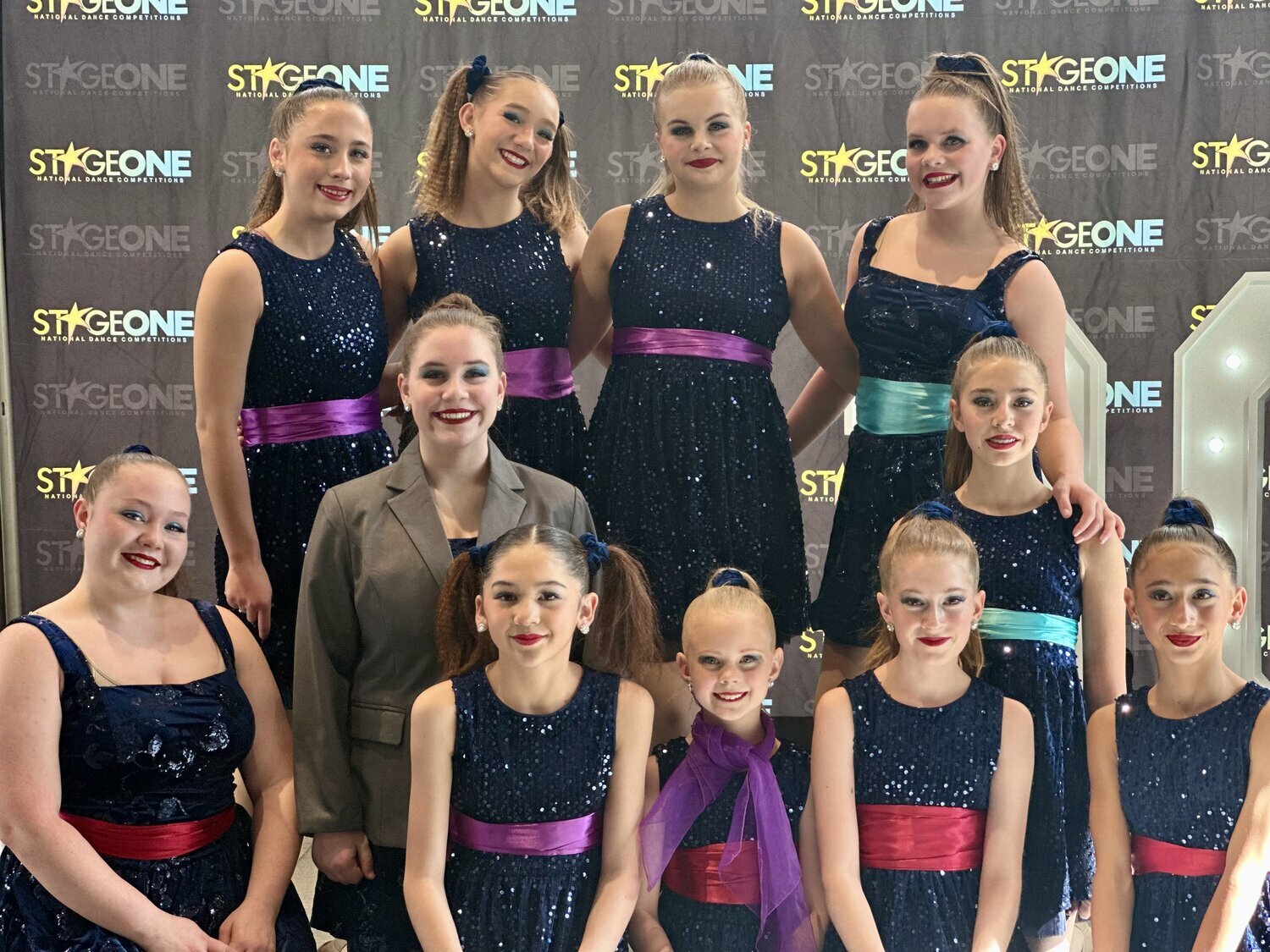 Members of the Expressions Dance Company pose for a photo after performing their large group routine, &ldquo;Footloose,&rdquo; which earned a special Judges&rsquo; Award at a recent regional competition.