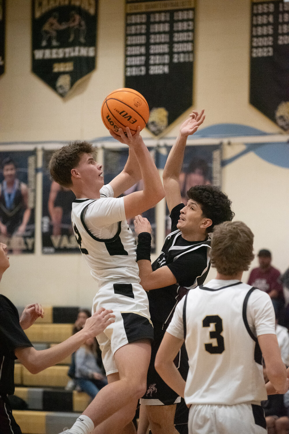 Pirate Ty Richey puts up a shot during the team&rsquo;s 57-42 win over the Alamosa Mean Moose on Friday, Feb. 13. Richey tallied 11 points in the game, as well as 11 rebounds.
