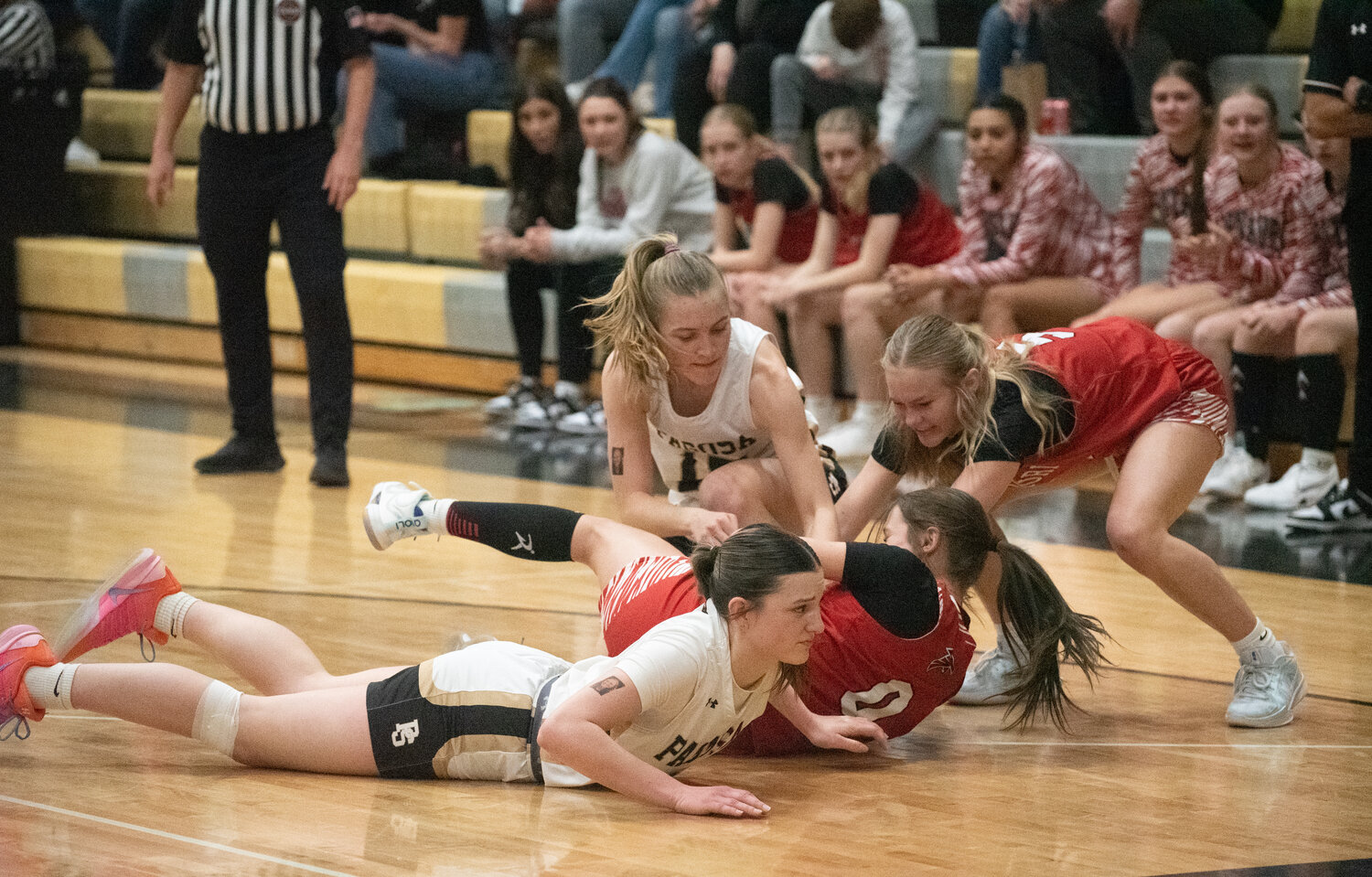 Lady Pirates Addie Hittle and Lexi Campbell fight for possession during the team&rsquo;s one-point win over the Centauri Falcons on Saturday. The Lady Pirates will close out the regular season in Bayfield this weekend.