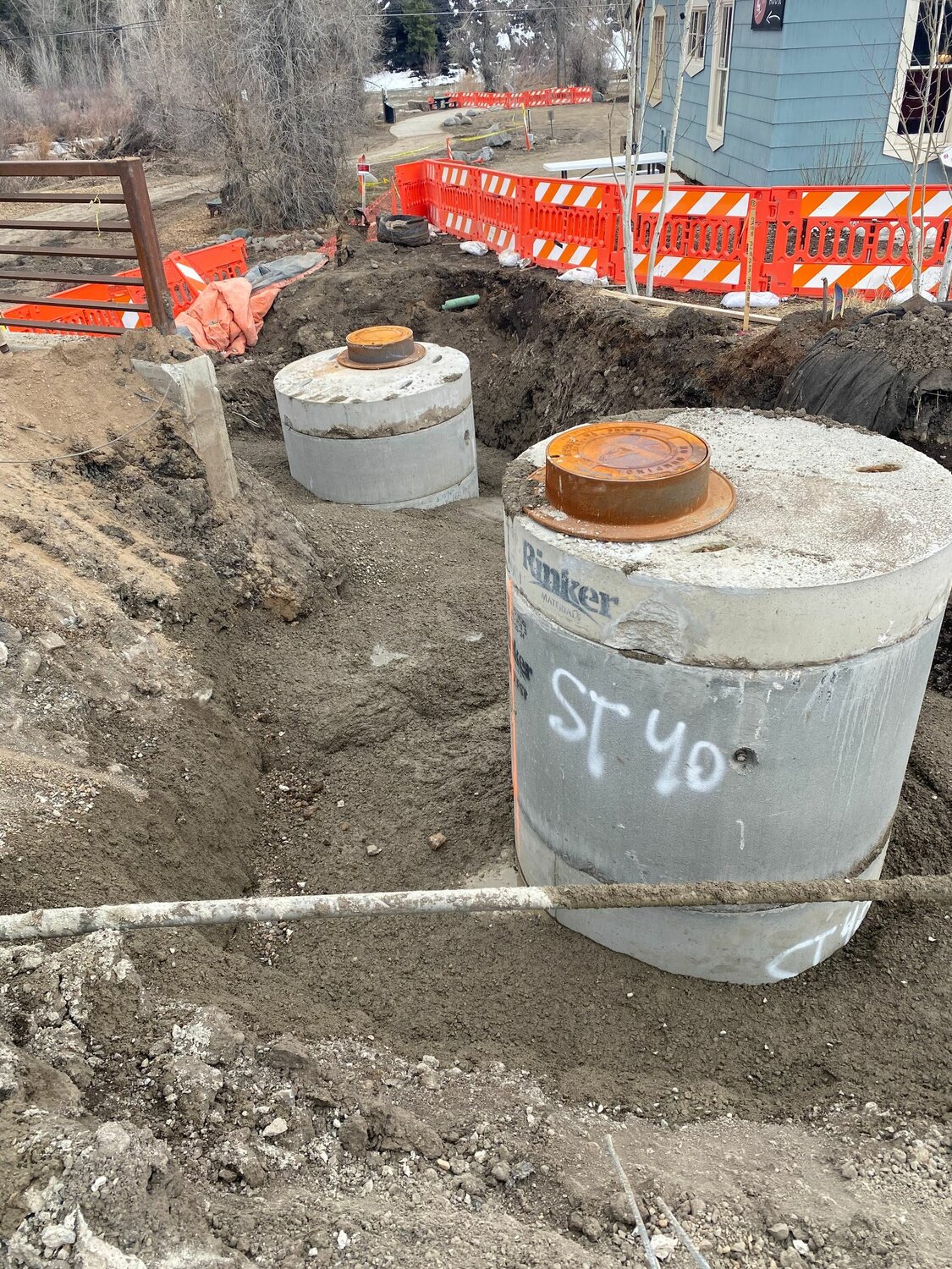Custom manholes are placed between 1st and 2nd streets.