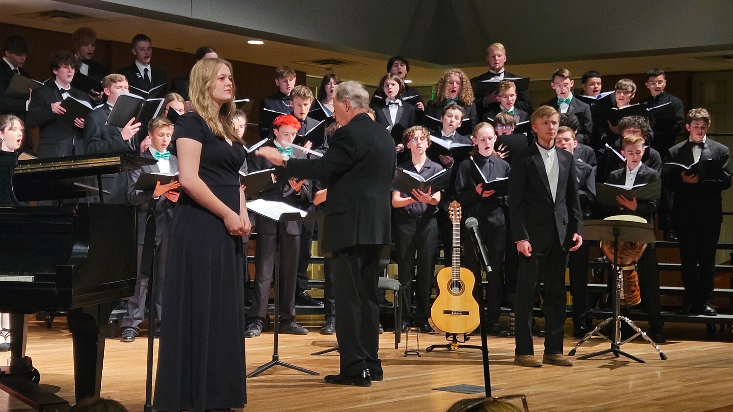 Connor Thomas (front, right) prepares for his featured solo during the Western Slope Honor Choir&rsquo;s Mixed Choir performance of &ldquo;Revelation.&rdquo;