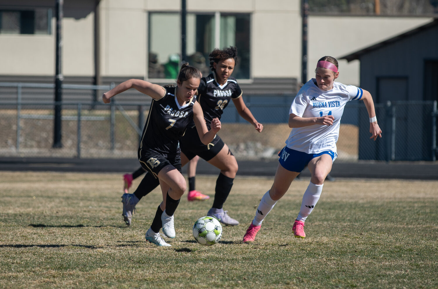 Lady Pirate Ximena Garcia pushes the ball forward past a Buena Vista defender while teammate Terriana Cage provides support during the matchup between the teams on Saturday, March 14. The Lady Pirates fell to Buena Vista after opening the season with a win, leaving them with a 1-1 record.