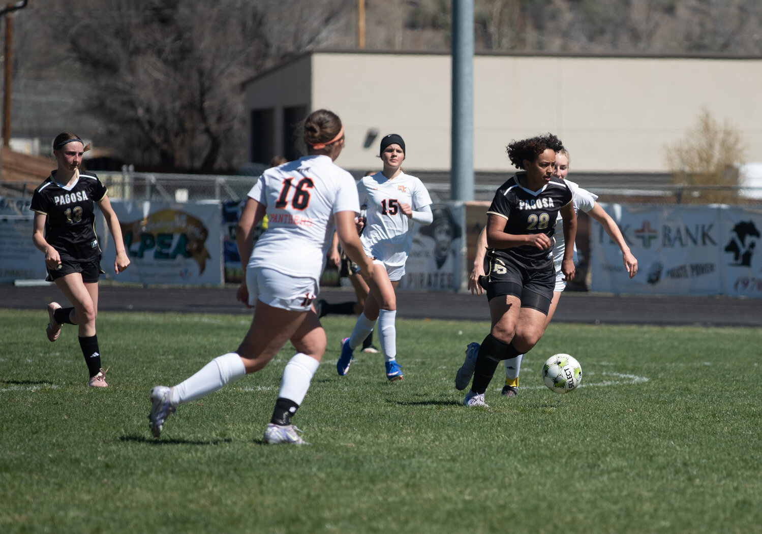 Lady Pirate Terriana Cage pushes through Panther defenders during the team&rsquo;s April 4 matchup with Montezuma-Cortez. The Pirates fell 4-0 in the matchup.