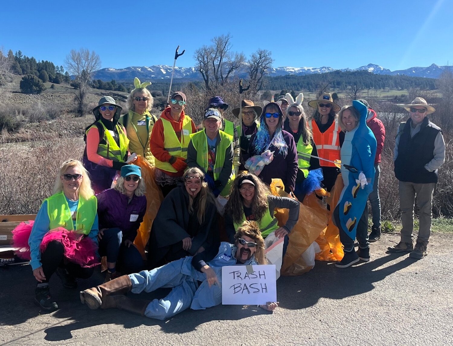 The TrashBash crew poses for a photo before cleaning up the riverfront area on the east side of Pagosa Springs on Saturday, April 4.