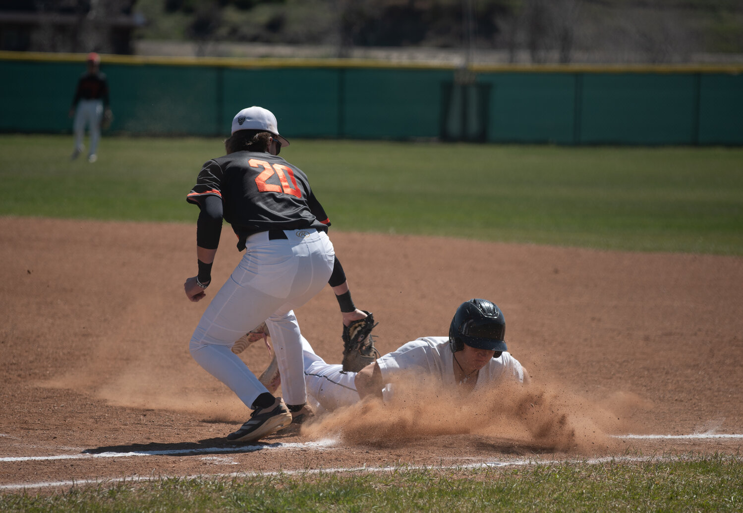 Pirate Zach Pouyer avoids a tag at first during the team&rsquo;s doubleheader against the Montezuma-Cortez Panthers on Saturday, April 18. The Pirates fell in both halves of the doubleheader.