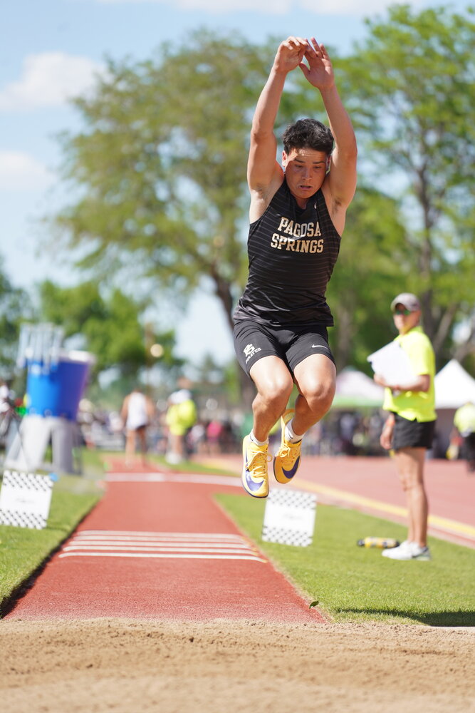 Pirates compete at the 3A state track and field meet in Lakewood on Thursday, May 14. Creede Dozier takes to the air for a jump in the triple jump. Dozier logged a personal best and finished sixth.