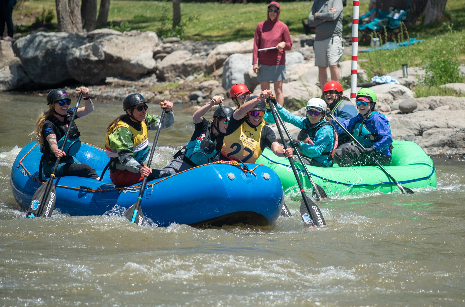 Rafters race down a course on the San Juan River at during the head-to-head competition at Saturday&rsquo;s Pagosa Paddle whitewater races.