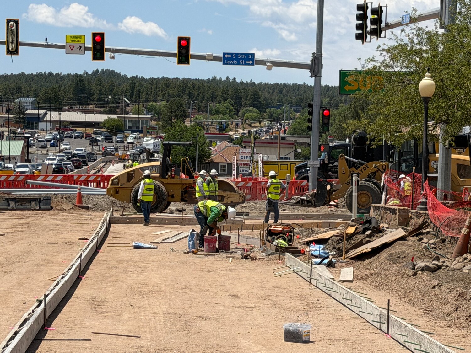 Crews set forms to prepare for concrete pouring at Lewis Street intersection on U.S. 160 earlier this week.