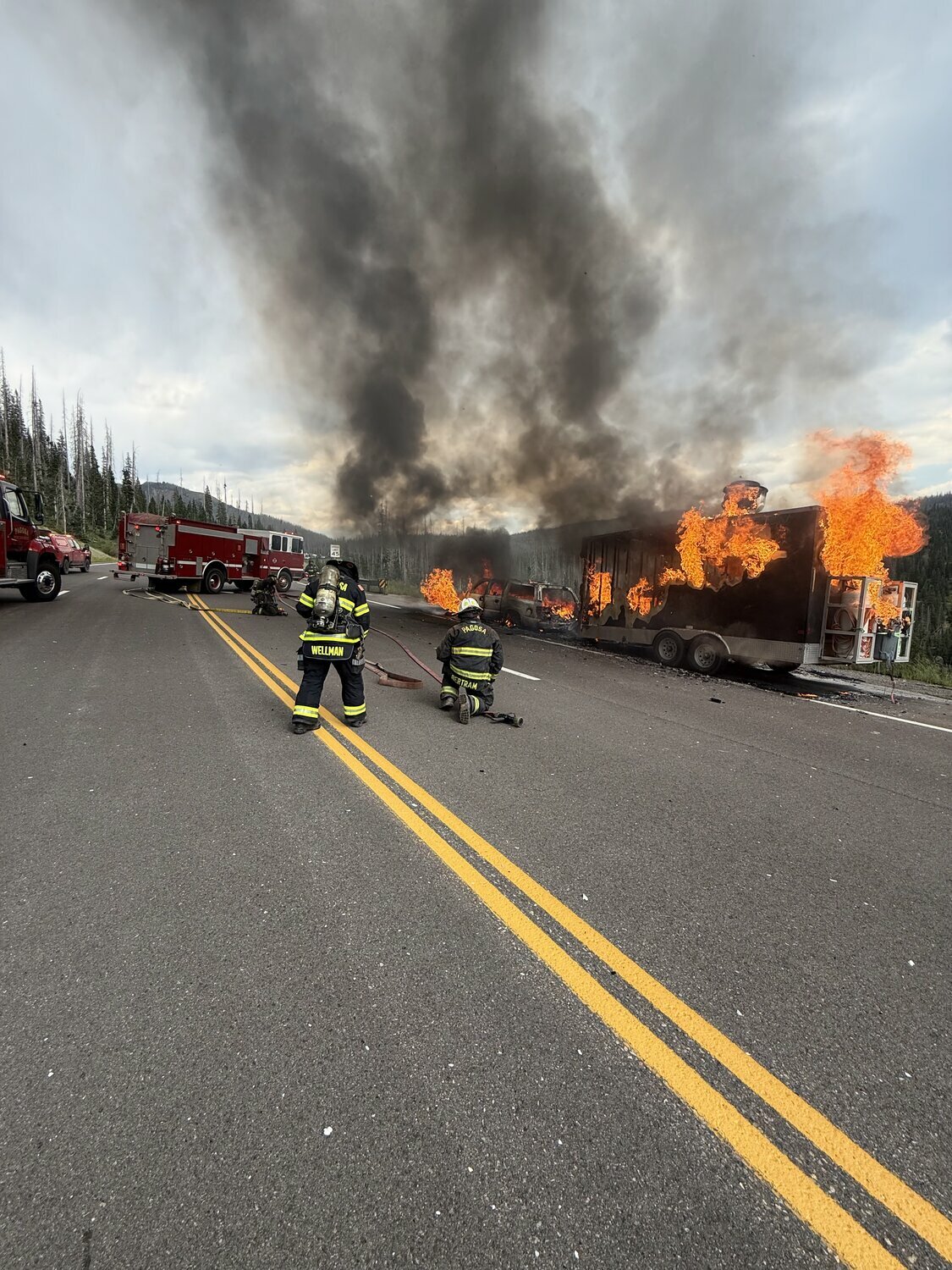 Pagosa Fire Protection District personnel battle a fire in a vehicle and attached food trailer on Tuesday afternoon atop Wolf Creek Pass.