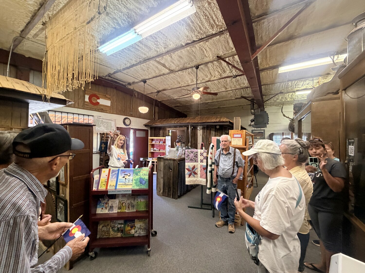Community members and visitors attend the closing of the Pagosa Springs History Vault during a ceremony on Saturday, Aug. 1. The vault contains items and writings showcasing the histories of the area and its inhabitants. Mayor and Pagosa Springs Main Street board member Shari Pierce was joined in sealing the vault by Amelia Everett, of Pagosa Springs, and Diego Garcia, of Albuquerque, N.M. &mdash; both 10. The youngsters were also invited back to help reopen the vault in 50 years.