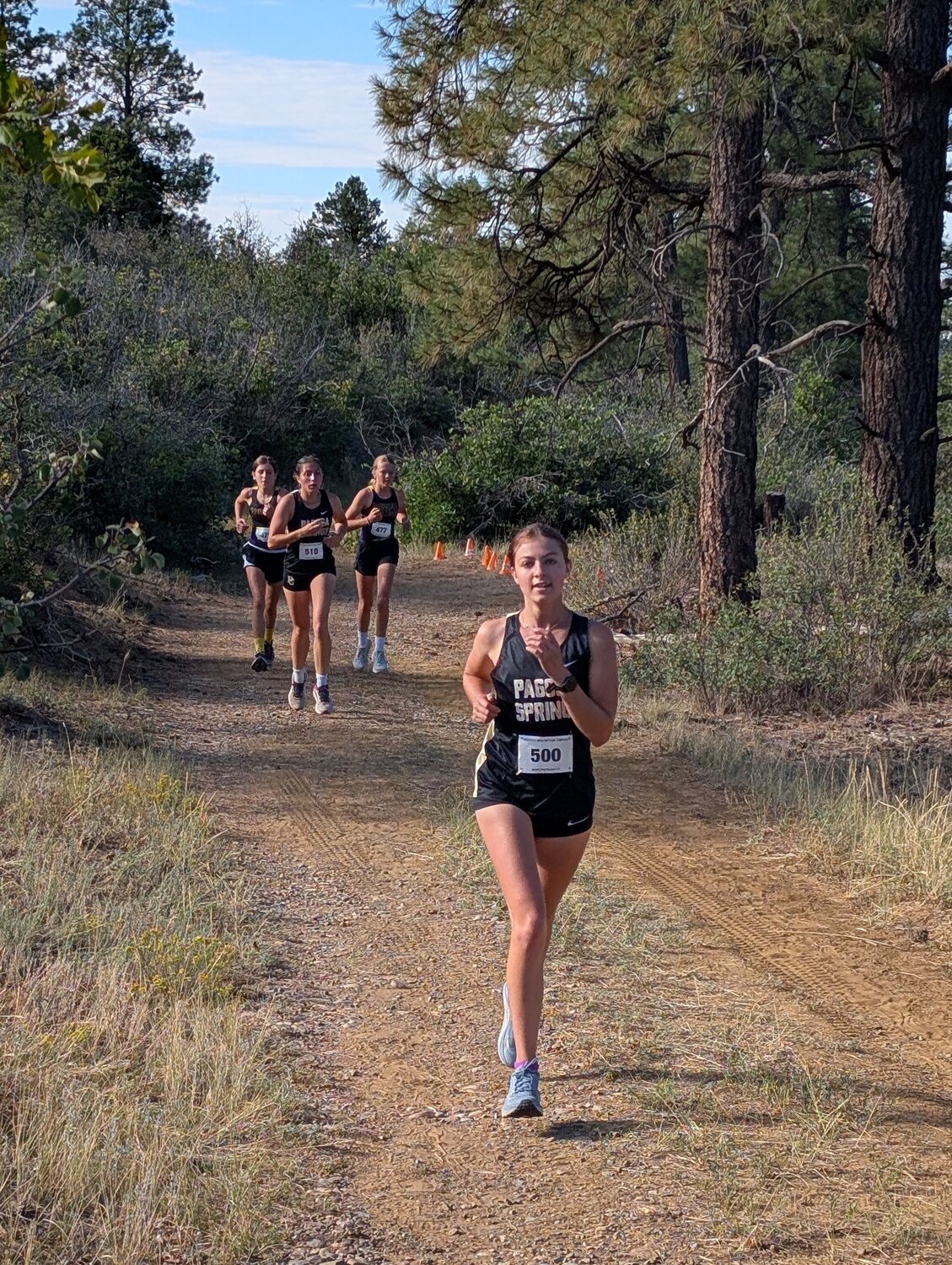 Lady Pirates Lucy Rivera, front, and Madi Stretton race at the team&rsquo;s opening meet in Bayfield on Saturday, Aug. 22. The Lady Pirates finished first as a team, with Stretton finishing sixth and Rivera taking seventh.