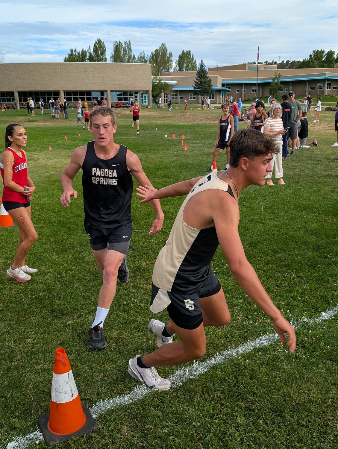 Pirate Stetson Osborn trades off with fellow Pirate Rylan Ash at the Durango Relay Carnival last weekend. At the carnival, the team split up into teams of two and ran 8 miles, alternating a mile lap at a time. According to coach Josh Kurz, Ash had the quickest average time per mile on the day, while Osborn was the most consistent.