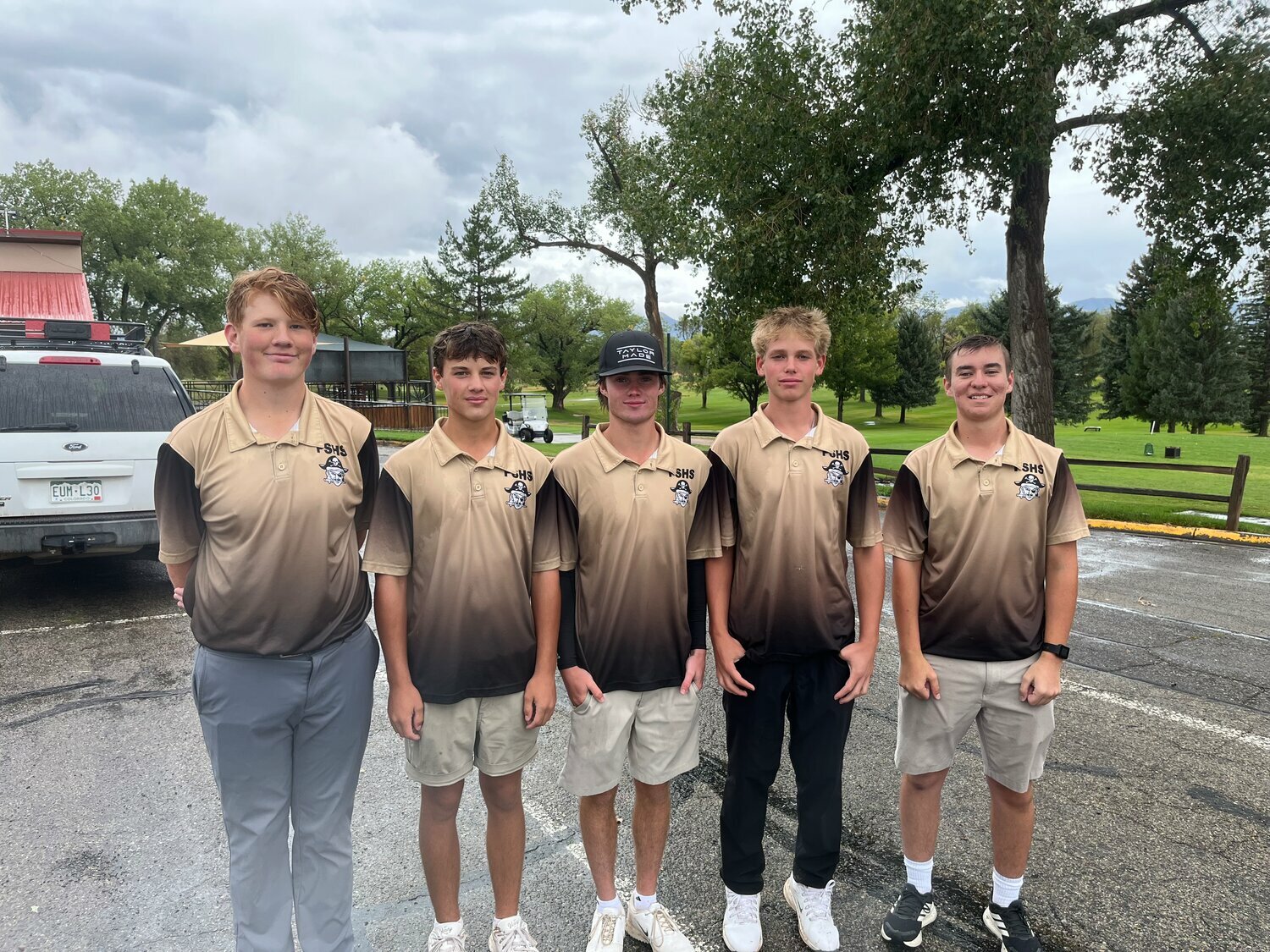 The Pirate golf team poses for a photo after a wet and challenging Panther Invitational 2 in Cortez on Monday, Aug. 31. Coach Mark Faber reported the steady rain made it difficult to even hold onto a golf club.