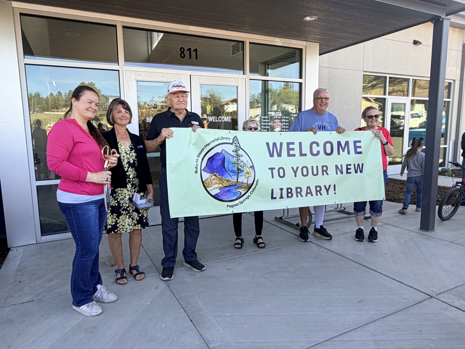 The Upper San Juan Library District Board of Trustees and Library Director Barb Brattin celebrate the grand opening of the expanded and renovated Ruby M. Sisson Memorial Library.