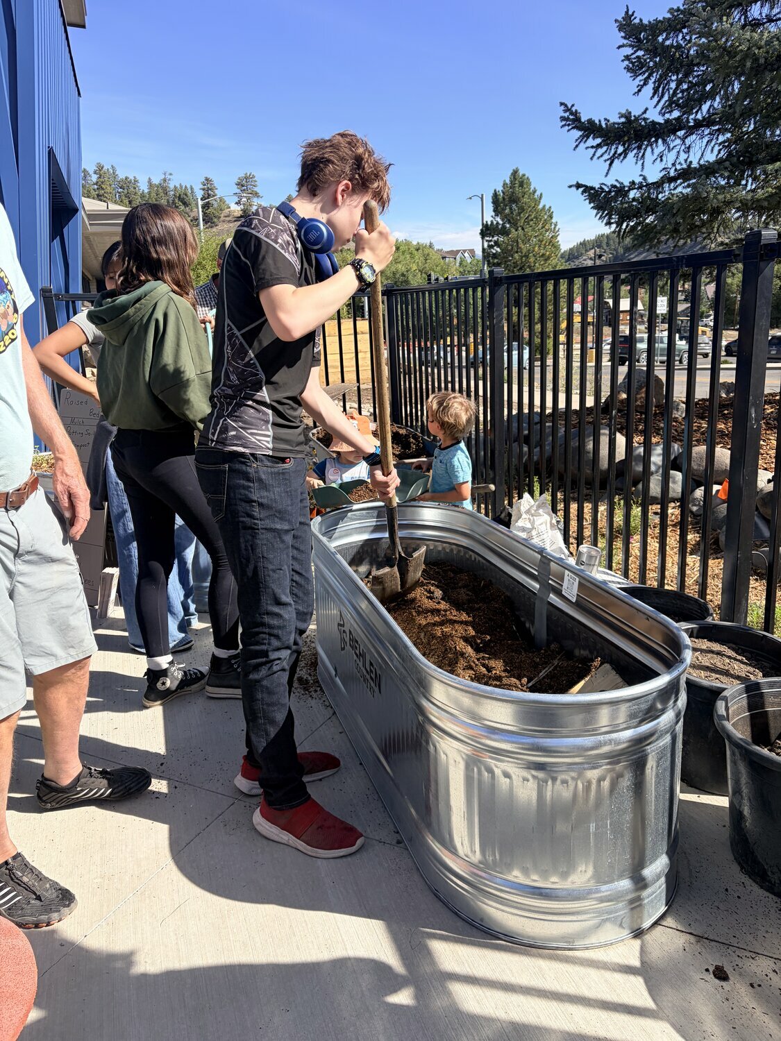 Youngsters of all ages take part in grand opening activities, which included planting in the children&rsquo;s garden and storytime with Smokey Bear and friends.