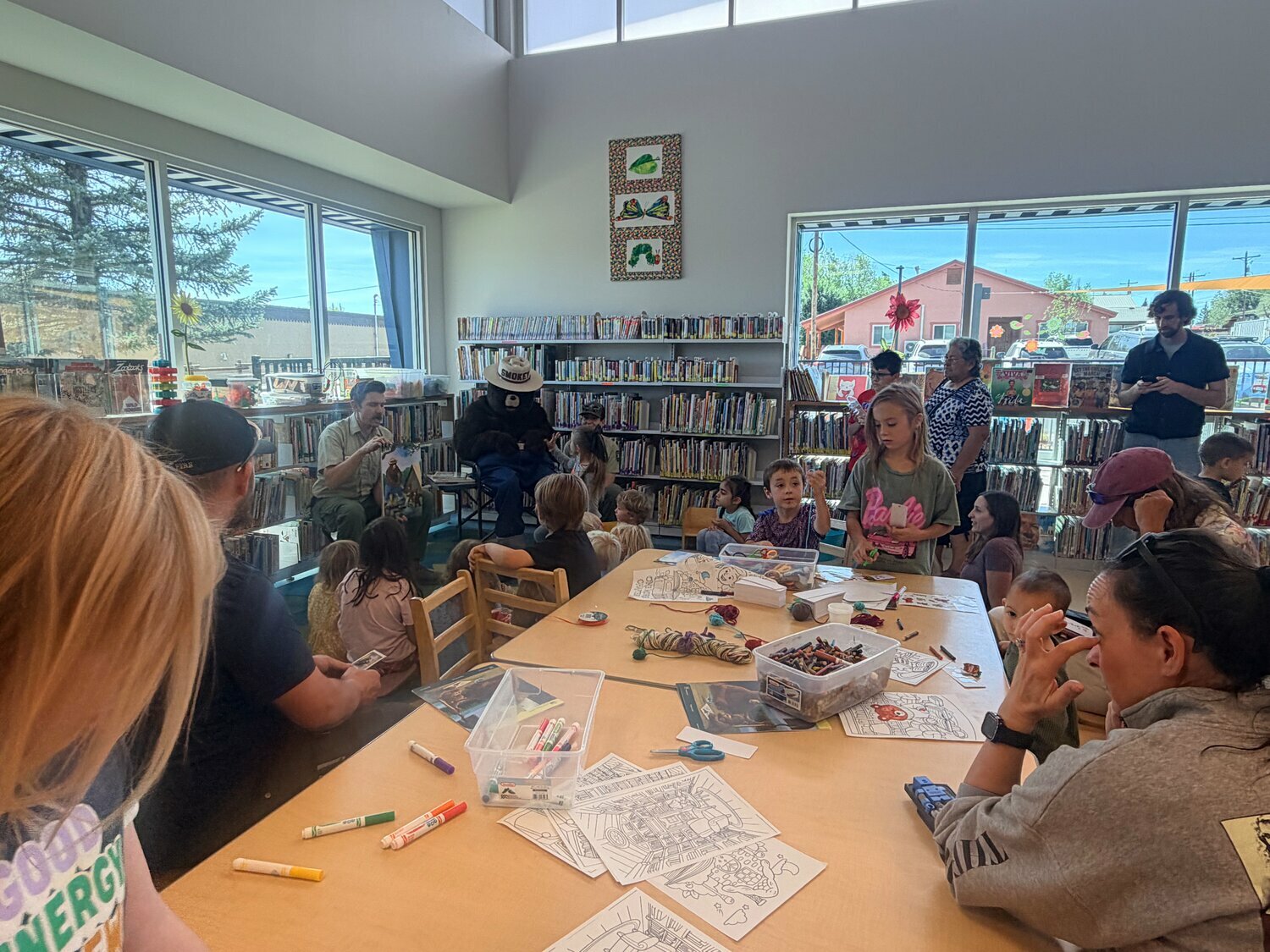 Youngsters of all ages take part in grand opening activities, which included planting in the children&rsquo;s garden and storytime with Smokey Bear and friends.