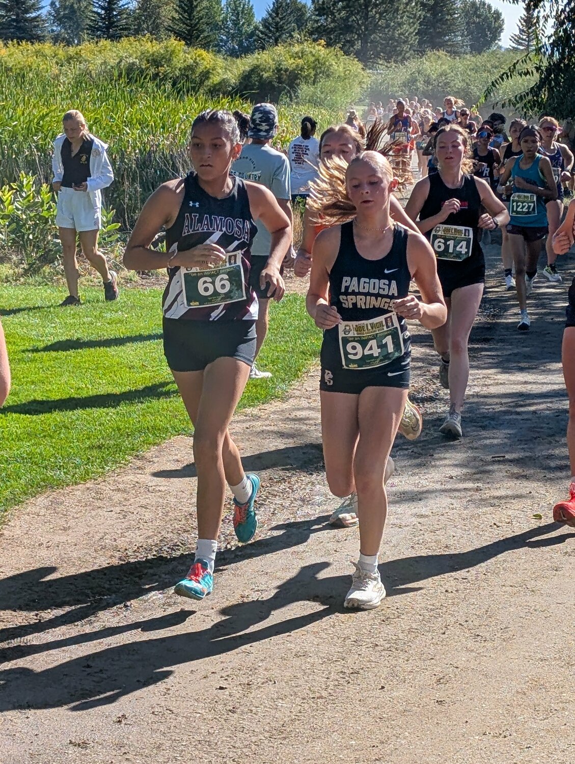 Lady Pirate Lily DeClark runs en route to a team-leading 103rd-place finish at the 33rd Joe I. Vigil Open in Alamosa on Saturday, Sept. 12. The team took 23rd out of 30 teams in the 354-runner race.