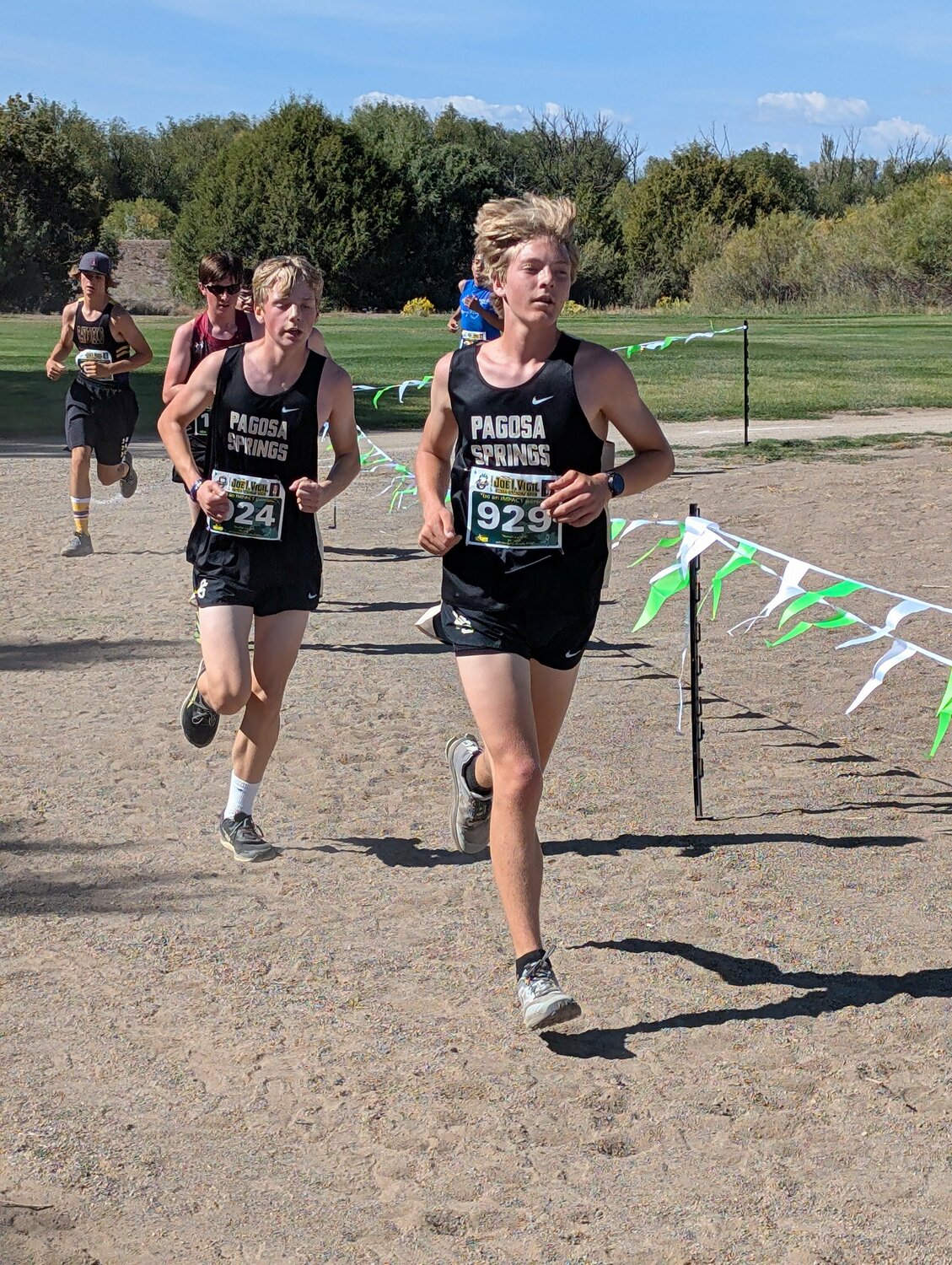 Pirates Breland Bridges, left, and Isaac Hanton, right, run at the 33rd Joe I. Vigil Open in Alamosa on Saturday, Sept. 12. The Pirates placed 22nd out of 37 teams, with 436 total runners in the race.
