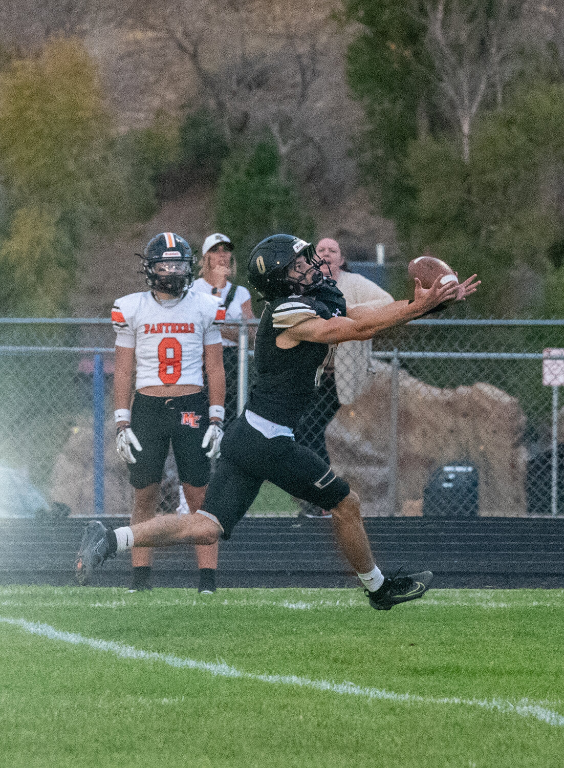 Pirate Hudson Mazur catches the ball before running it into the end zone for a Pirate touchdown against the Montezuma-Cortez Panthers on Friday, Sept. 11. The Pirate win gave the team a 1-0 league record.