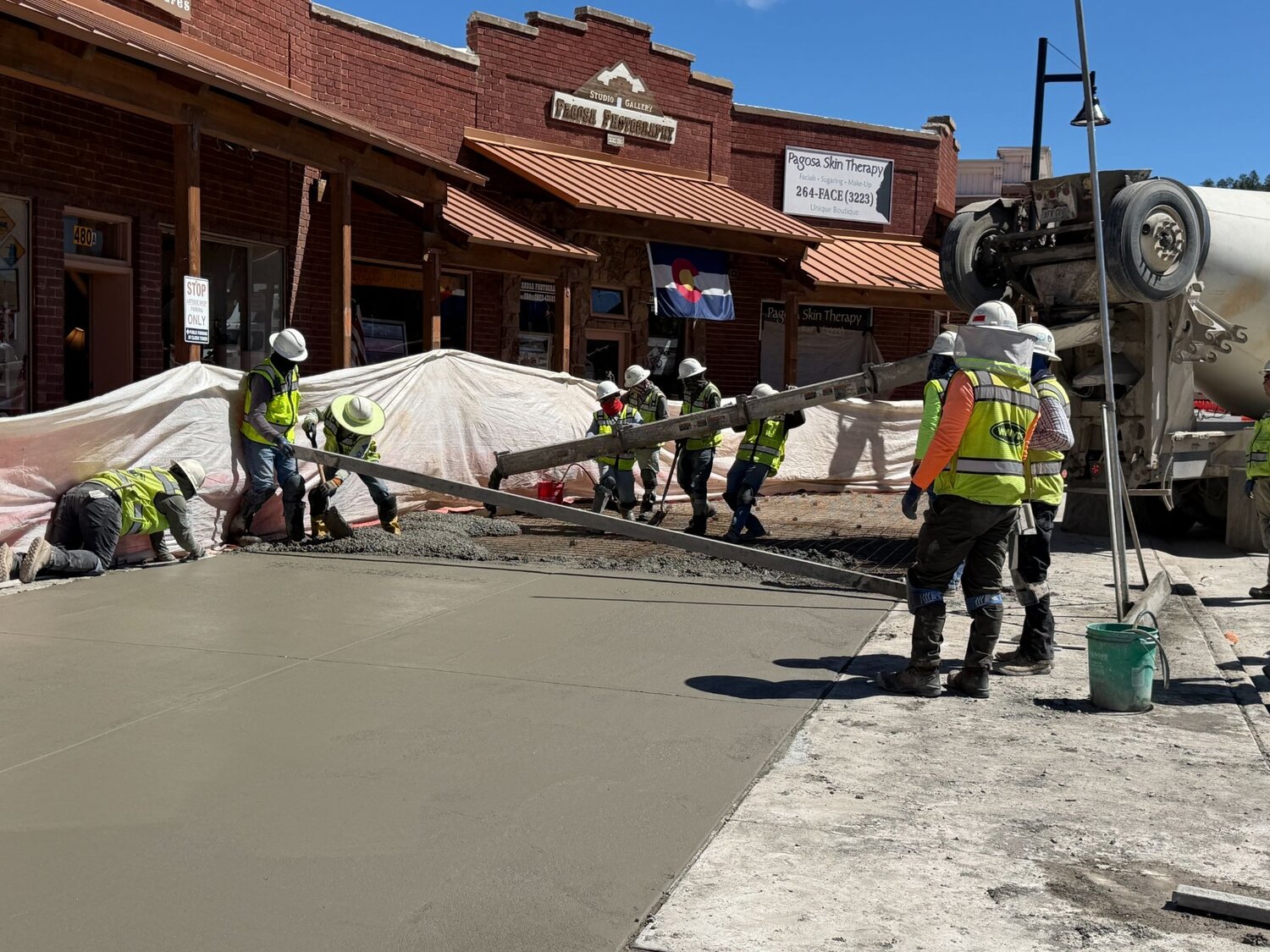 Crews pour and form the commercial vehicle parking area in front of Memory Lane and Pagosa Photography. This driveway will be used for deliveries only.