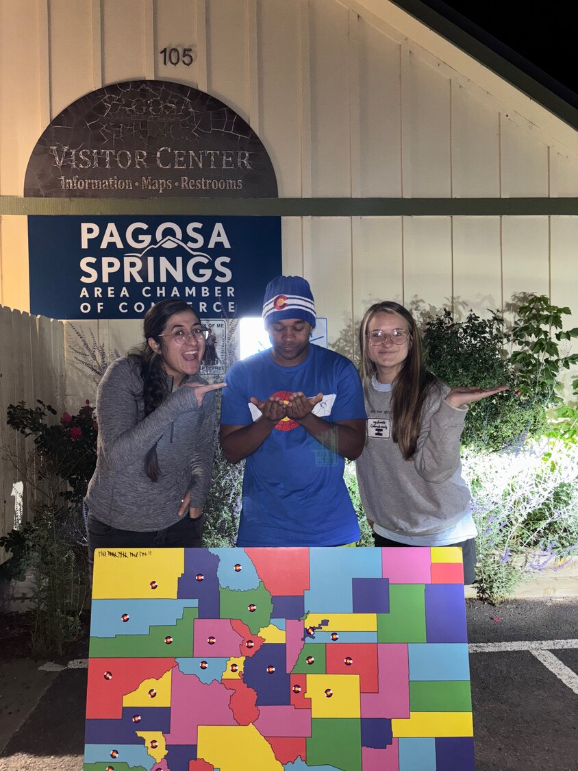 Road-trippers Holly McCollough, Floyd Pierce, and Leilani Osmundson stop in Pagosa Springs as part of their quest to visit all 64 Colorado counties in less than 64 hours this summer.