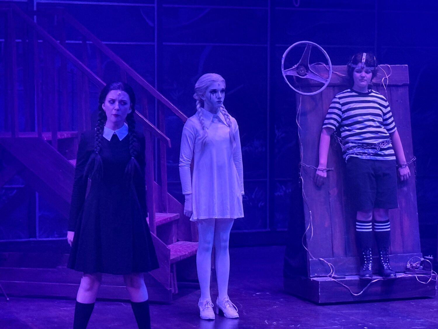 From left are Olive Fladwood as Wednesday Addams, Brooke Anderson as an Addams ancestor and Gabby Padilla as Pugsley Addams in Thingamajig Theatre Company&rsquo;s production of &ldquo;The Addams Family Young@Part&rdquo; at the Pagosa Springs Center for the Arts.