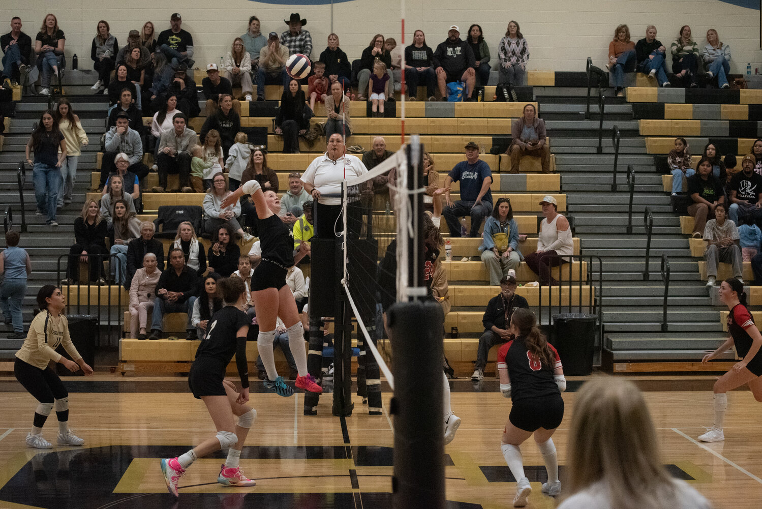 Lady Pirate Dawson Iverson sends the ball across the net as her fellow Pirates provide backup against the Ignacio Bobcats on Monday, Oct. 26.