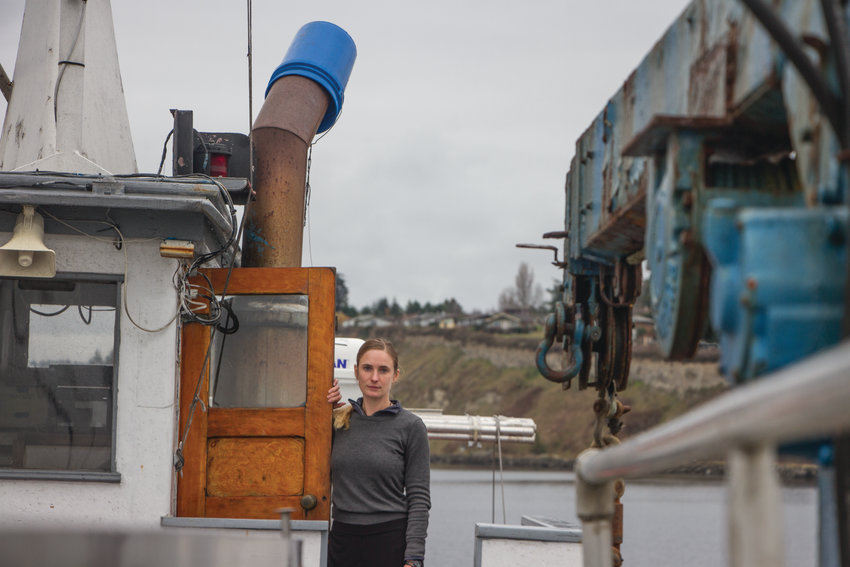 Rebecca Argo at the wheelhouse of the 76-foot scow Sunnyvale, a salmon tender, which she captained last summer. Argo&rsquo;s salmon tender operates out of Port Townsend&rsquo;s Boat Haven, serving southeast Alaska. Her experiences as skipper brought her to Rome in November, where she spoke at the United Nations sustainable fisheries conference.