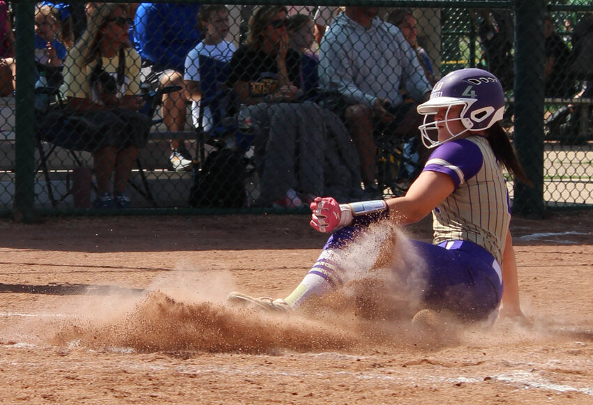 Gracie Daniel (4) slides home to score the Viqueens' first run of the game. She went 2-3 at the plate with a double in the win against Westview.