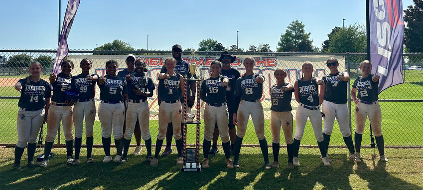 The 14U Dirt Dobbers posing with their second-place trophy at the USSSA Nationals with HC Cam Farrell (center, back).