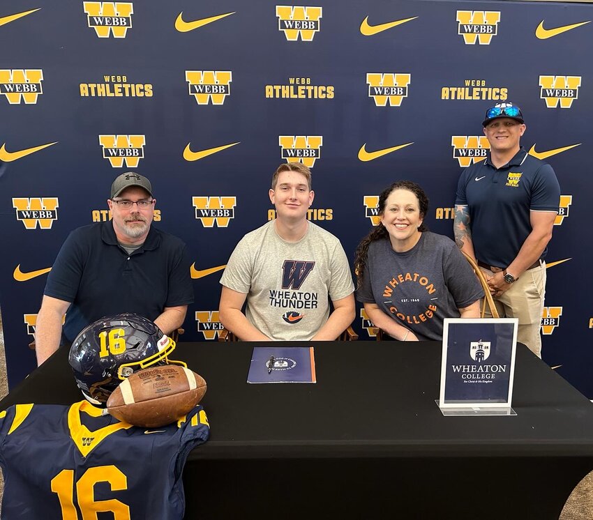 Ethan Crunk with his parents after signing to continue his football career for the Thunder of Wheaton College in Wheaton, IL.