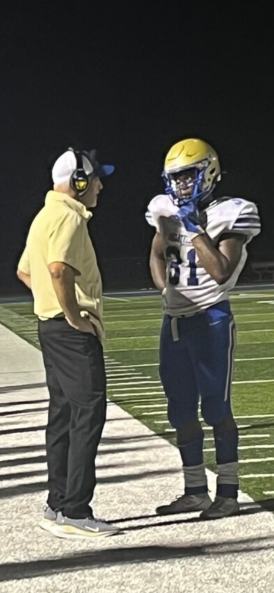 John Dryden (left) and Robert Bailey (31) on the sidelines following one of his three touchdowns.