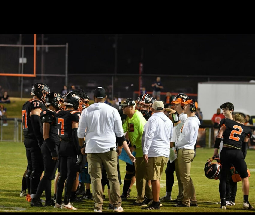 Glenn Tidwell (middle in neon hoodie) gives instructions during a TO while at Cascade.