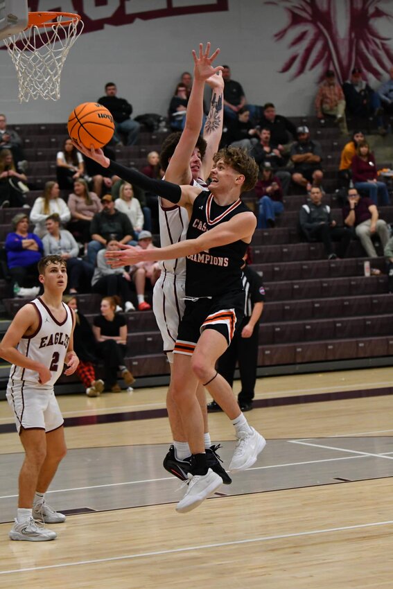 Noah Watson (2) scoops in 2 of his 9 points at #1 Eagleville.
