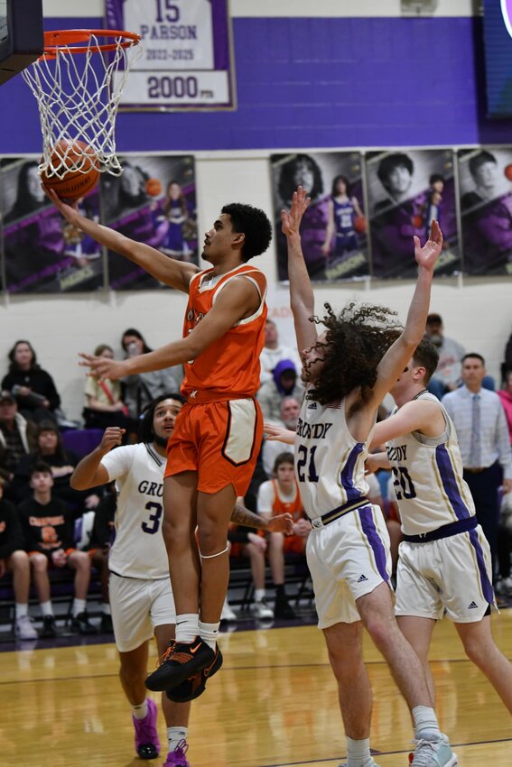 Jason Cullum (3) soars in for two of his 15 points in Friday's loss.