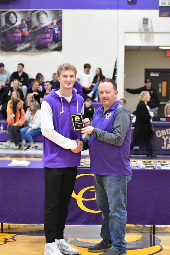Landon Lovvorn (purple, 11) was named to the District 9-AA All-Tournament team on Monday night. He averaged 14.3 PPG over three games for the Vikings.
