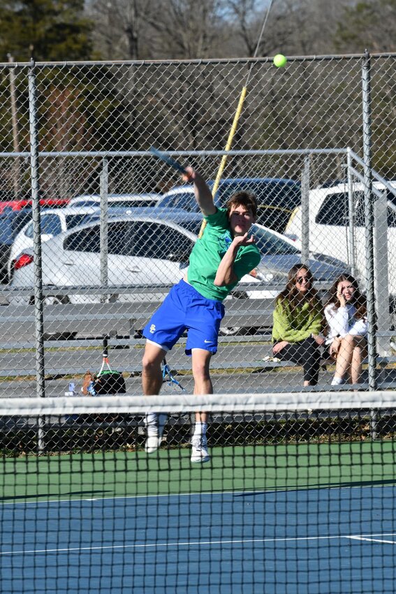 Henry Stone (pictured) serves against Lewisburg on Monday. Stone dominated in his singles match, winning 8-0, while also winning the doubles point with Tucker Johnson, 8-1.