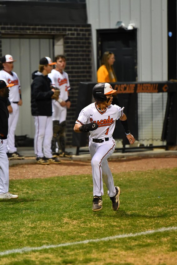 Jordan Childress (1) heads home on Thomas Demartelaere's third-inning RBI double to score Cascade's first run of the game. Childress, batting leadoff for the Champions, went 3-4 at the plate with a pair of runs scored.
