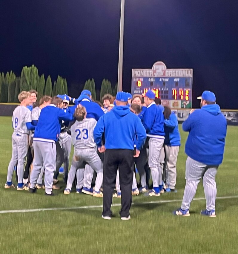 Palmer Edwards (23) tries to lift his head coach, Chase Jones, in celebration following Jones' 400th career win as a head coach on Tuesday.