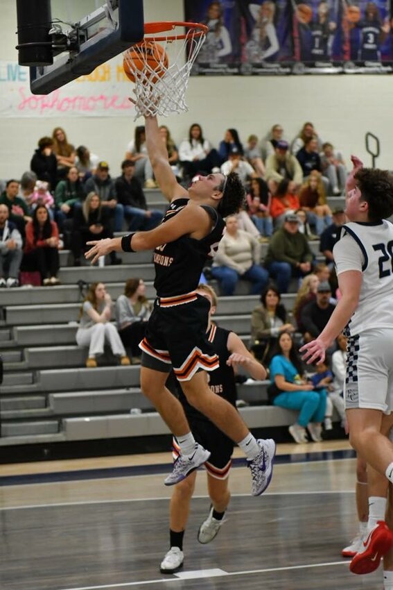 Tyler Rodgers (25) soars through the lane for two of his 13 points in Tuesday's win.