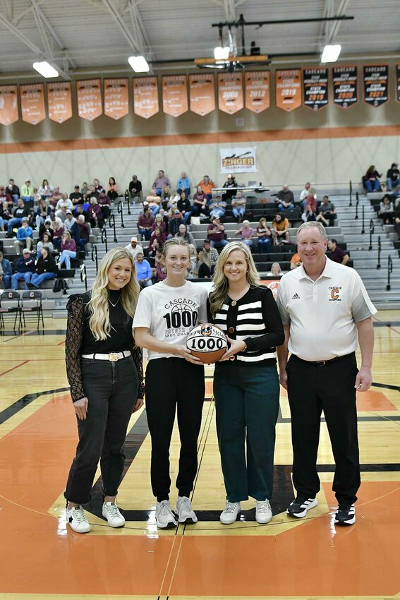 Kaegan Young (center, left) was recognized at halftime of the Boys' game on Friday night after she scored her 1,000th career point at Franklin County to open the year.