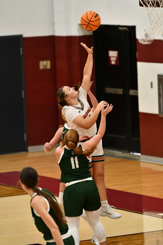 Jocelyn Laughlin (25) lays in two of her career-high 10 points on Monday. Laughlin also finished with 6 rebounds and 3 assists in the win.