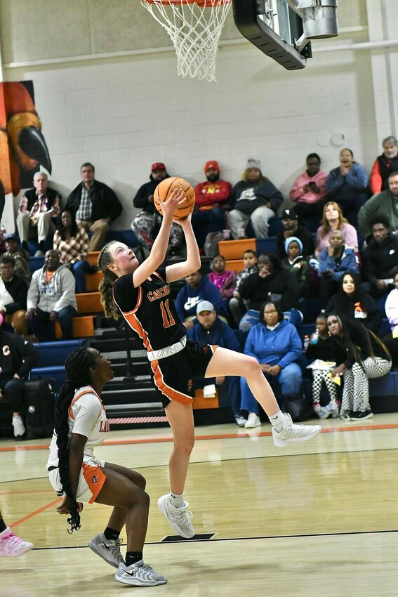 Lizzie Keele (11) lays in two of her 13 points in Friday's win. She also dished out 6 assists to go along with 3 rebounds.