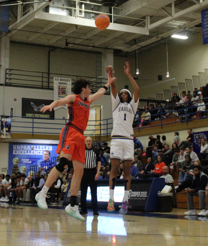 Jordan Taylor (1) fires away from downtown against Summit. The senior finished with 15 points in Thursday's win and connected on a pair of three-pointers.