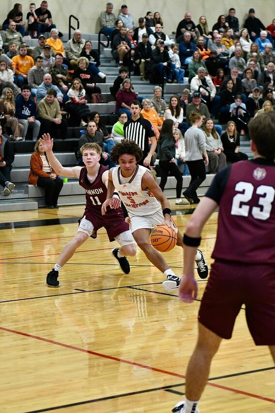 Kaleb Kelso (5) finished with 14 points, 4 assists, 3 rebounds, and 1 steal in Friday's loss to Cannon County.