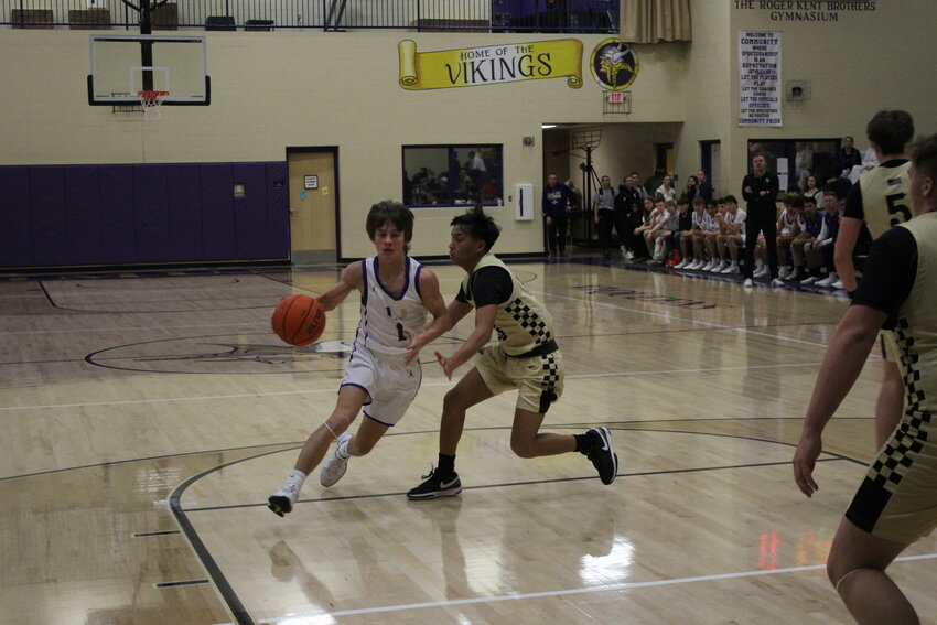Johnathan Lawwel (1) drives the paint against the Bulldogs. Lawwel finished with 11 points, including a team-high five points in overtime, in Friday's loss.