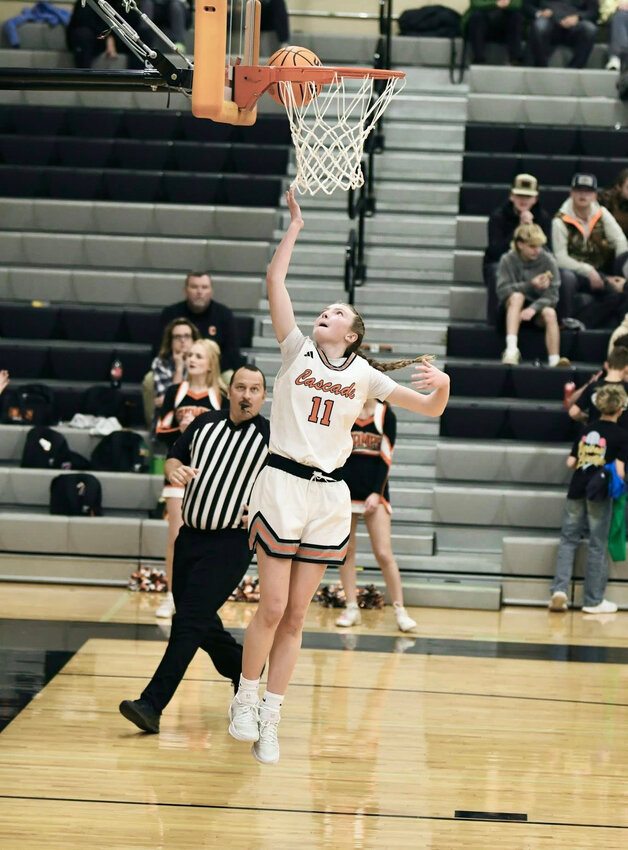Lizzie Keele (11) lays in two of her 14 points during Monday's win over Murfreesboro Central Magnet.